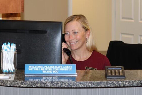 Woman at detal office desk