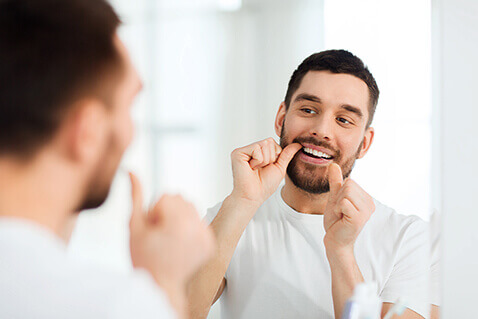 Man flossing