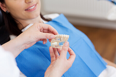 Woman having dental implants