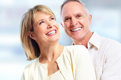 Older couple with white straight smiles